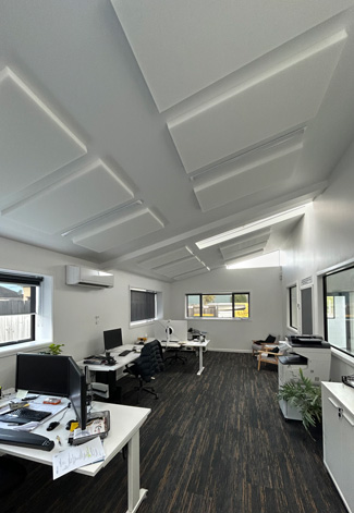 White Acoustic Ceiling Panels in an Open Plan Office.