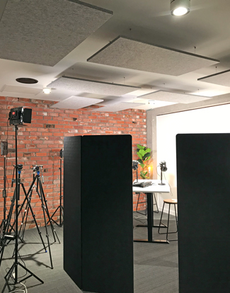 Designer grey marl ceiling acoustic 
panels and black Gobos in Audio Visual Recording Studio.
